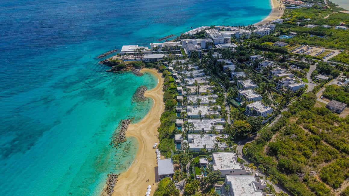 Sustainable tropical beach resort representing travel suppliers adapting to carbon disclosure trade requirements