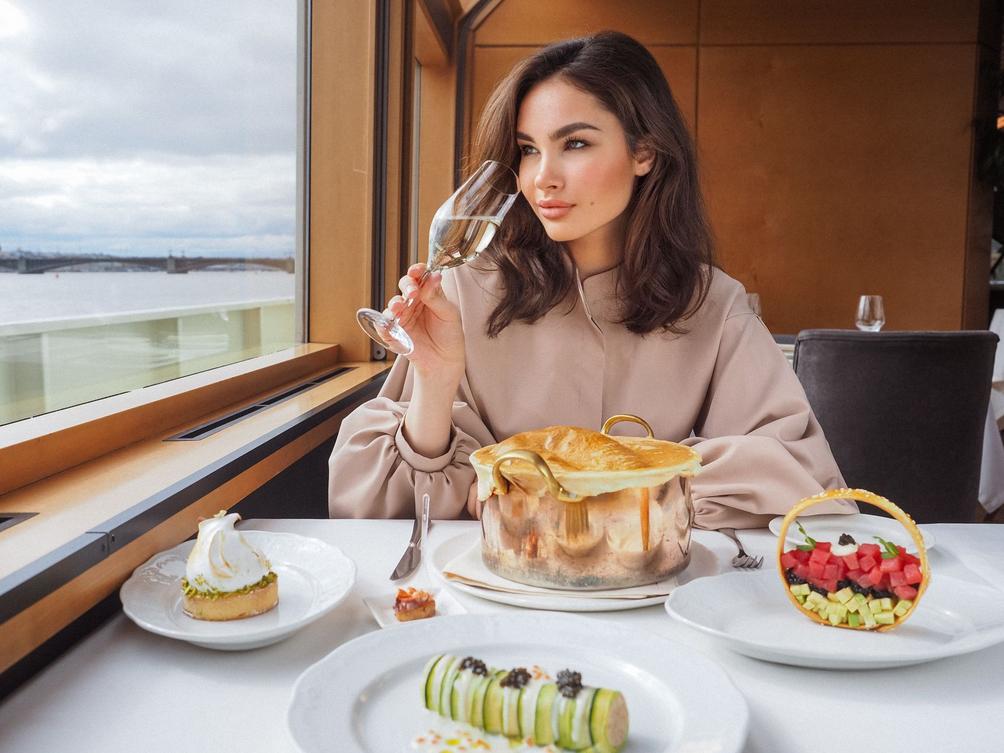 Curated food travel product experience setup with chefs preparing dishes in a scenic destination