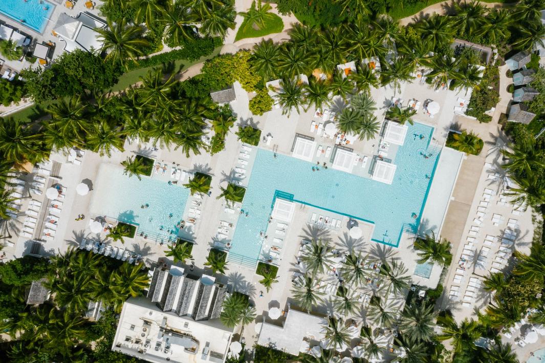 Luxury hotel poolside overlooking the ocean, illustrating hotel direct-booking strategy challenges